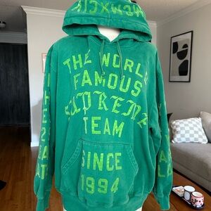 Supreme Green Hoodie with Bold Yellow Graphics
